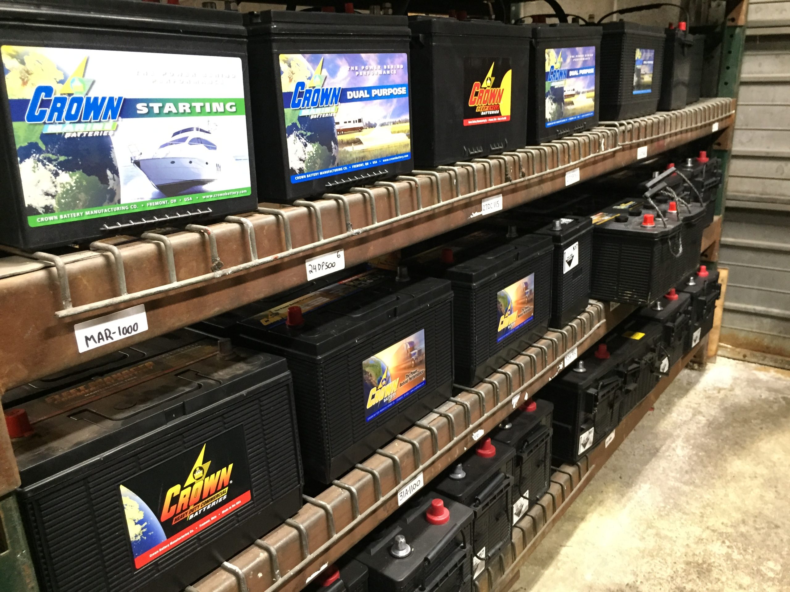 Shelves full of Crown batteries in the Erie Batteries, Alternators, Starters warehouse in Erie, PA is shown here